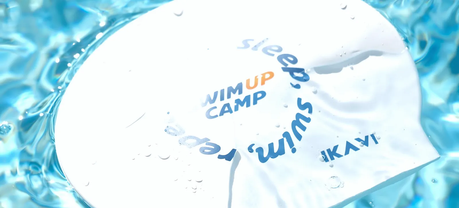 February 2025, Gloria Sports Arena: a SwimUp Camp swim cap on the water.